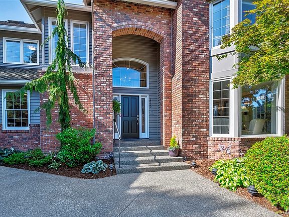The meticulously maintained landscaping and stately entry offer hints of what you will find inside.