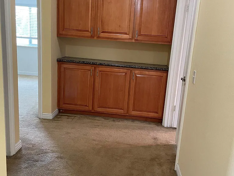 Upstairs hallway with plenty of cabinets for storage space