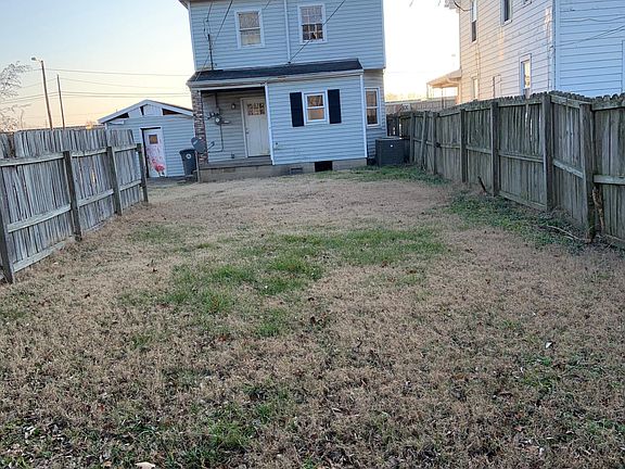 partially fenced in back yard