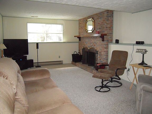 Family Room light and bright with neutral carpet.