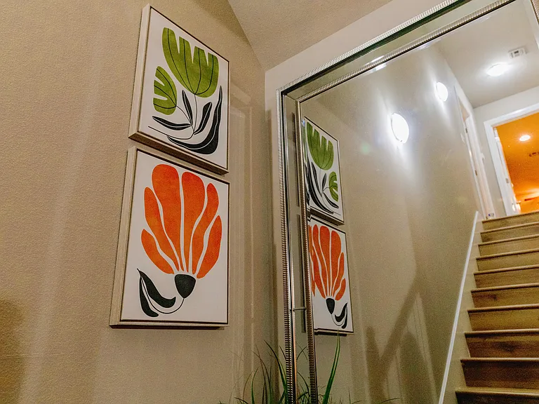Stairs reflected in mirror going upstairs