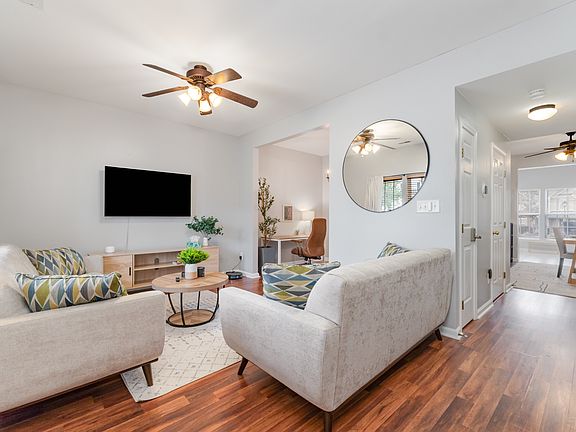 Large living room with seating for up to 5 people. Includes 55" Amazon Fire Smart TV.