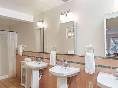 Bathroom #2 - Three Pedestal Sinks & two Large Showers