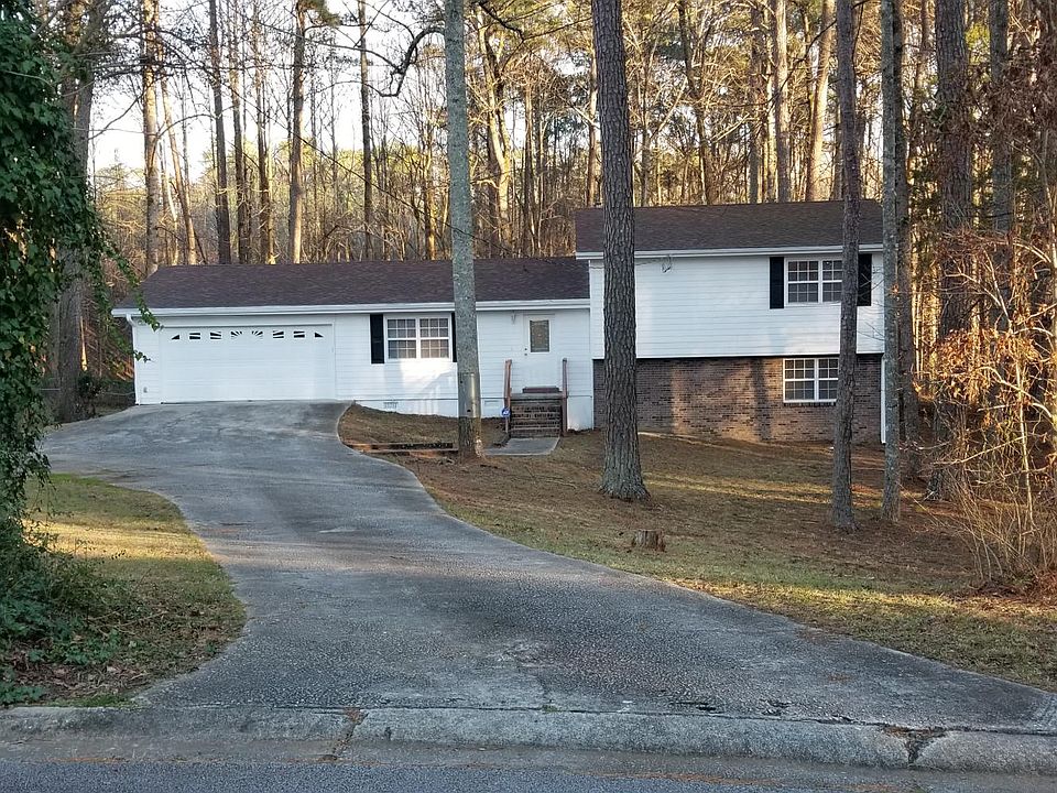 House has garage door opener with outside keypad and one car clicker