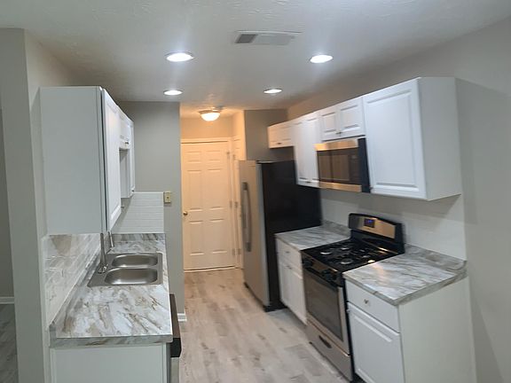 Kitchen with brand new white cabinets and appliances!