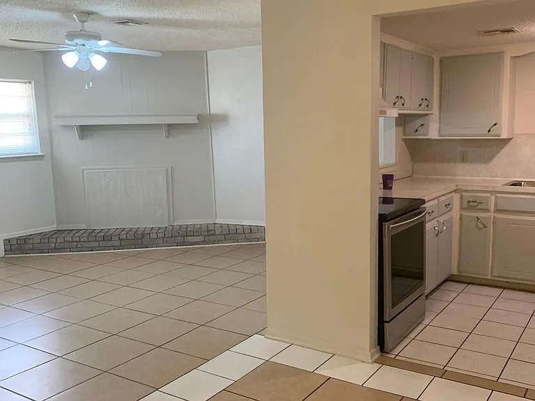 another view of living room, dining room and kitchen
