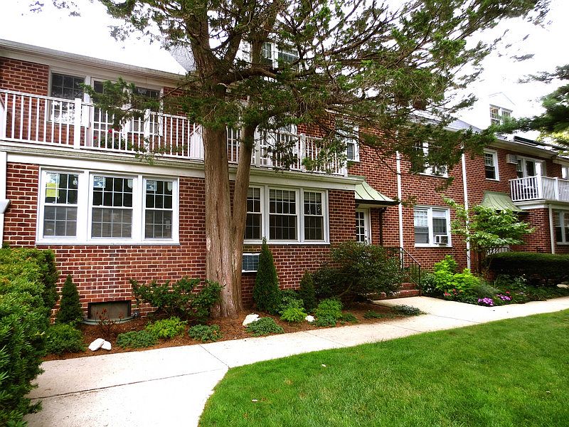 Front of Building
						:
						Apartment can be seen to the right of the tree in this picture.