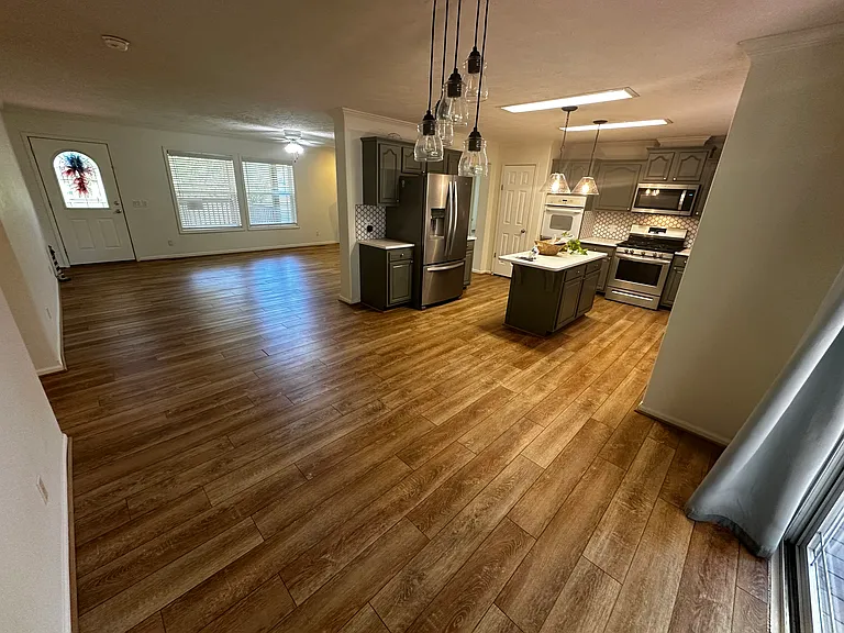 Looking at kitchen and living room from the back sliding door.