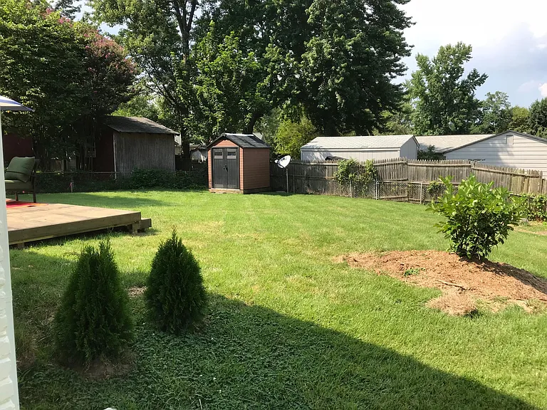 Large back yard with new shed for storage.