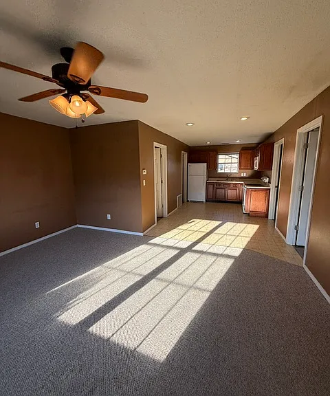 Living room looking towards kitchen dining
