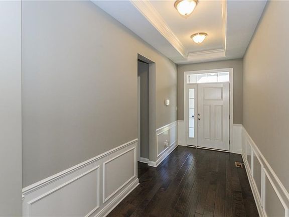 Beautiful entry with wainscoting & hardwoods