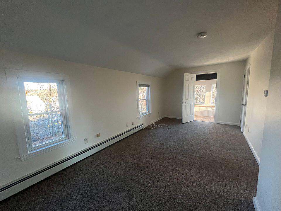living room with entrance to three season porch.