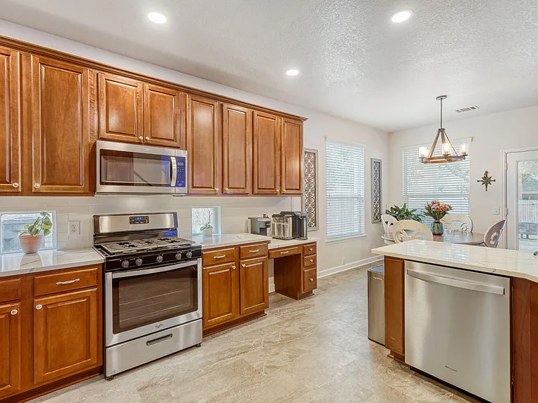 open concept kitchen with brand new appliances to include gas cooking