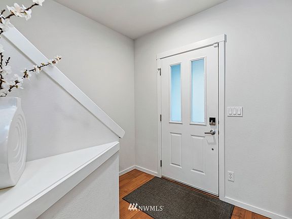 Hardwood floors grace the foyer.