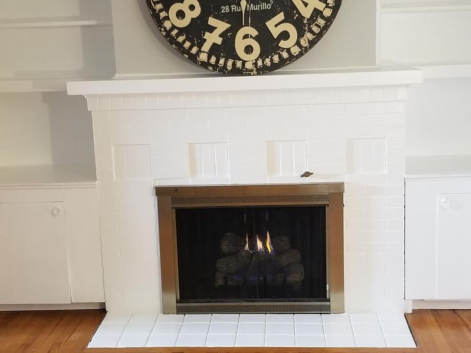 Fireplace with built-ins in living room.