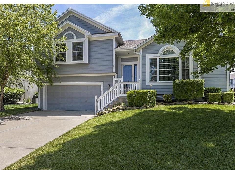Front of the home with beautifully maintained yard.