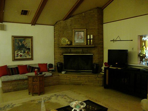 Family room with fire place and high ceilings