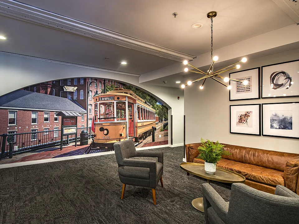 Resident clubhouse lounge featuring comfortable seating, entertainment space, and modern amenities