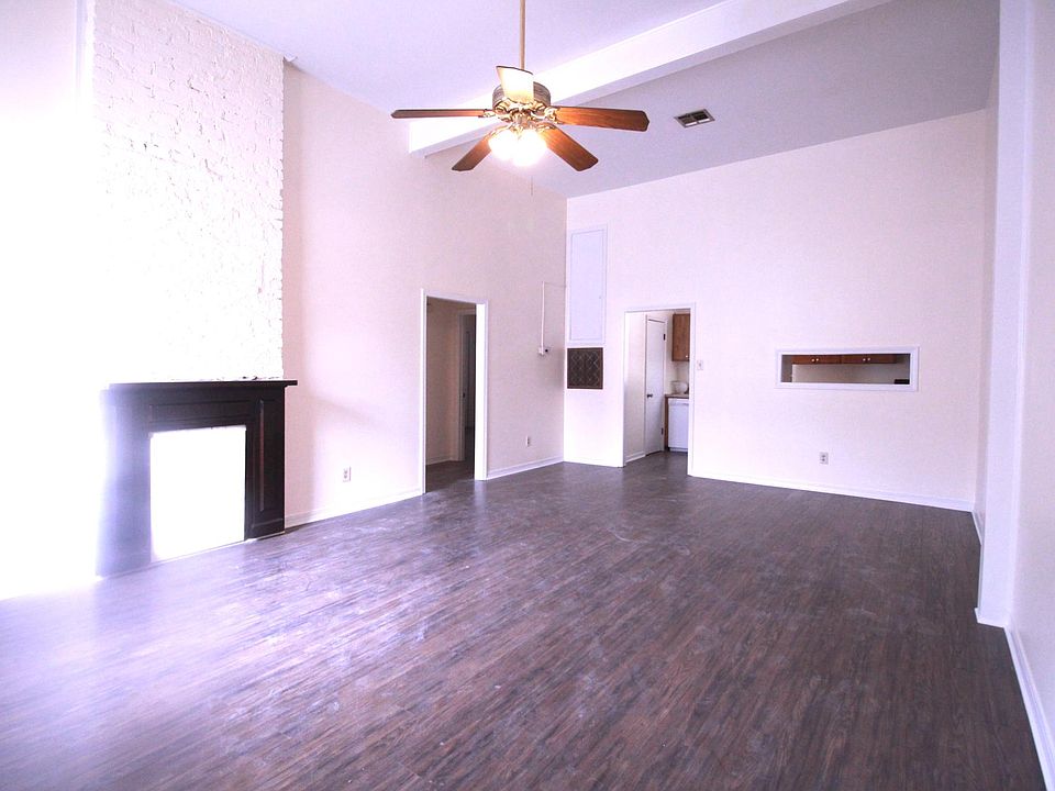 Living room with ornamental fireplace.