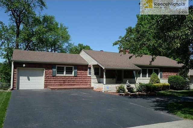 Front view with extra wide driveway.