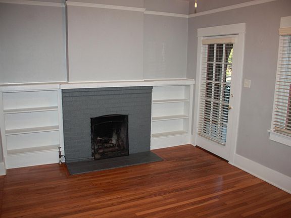 Living room with gas fireplace and front door