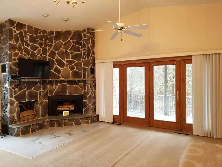 Master Bedroom with Fireplace and walkout private balcony.