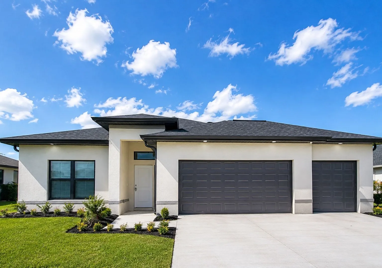Brand-New Luxury Home with 3-Car Garage & Lawn Care Included | Modern Living in Cape Coral! — Photo 1