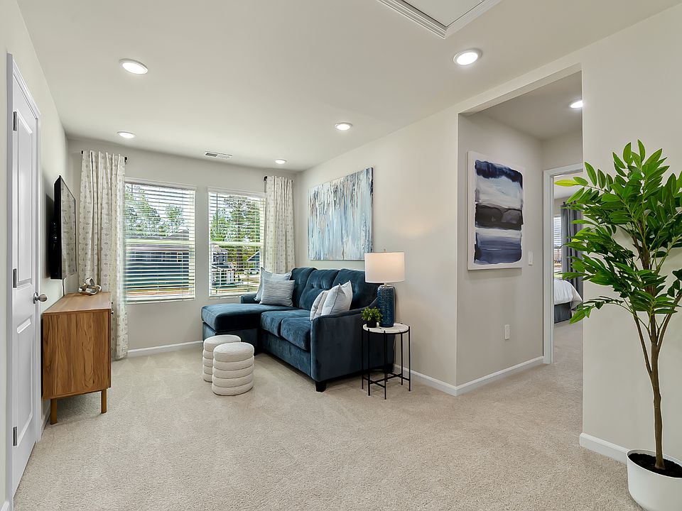An upstairs loft provides a secondary entertainment space.
