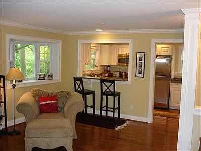 Open floor plan, hardwood floors, crown molding, fireplace