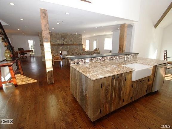 Large island is adjacent to the open and airy floor plan