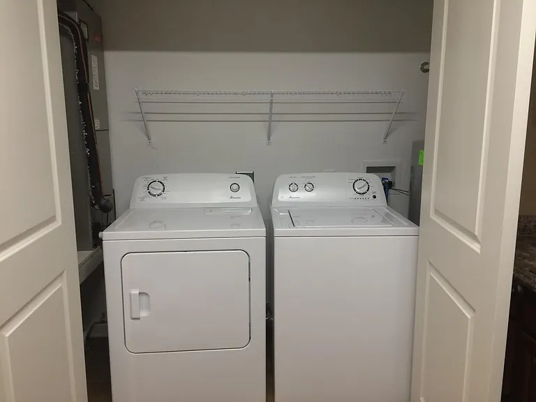 Utility closet accessed from kitchen