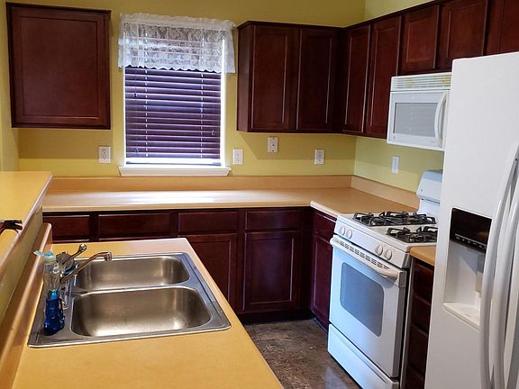 kitchen with refrigerator, gas range and dishwasher