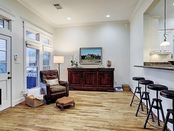 The breakfast room between the kitchen and living room is spacious and bright â a perfect spot for family and friends to congregate around the kitchen.