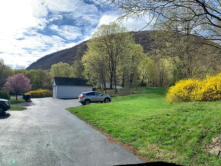 Panorama of parking lot with views of the Hudson River and Storm King mountain.