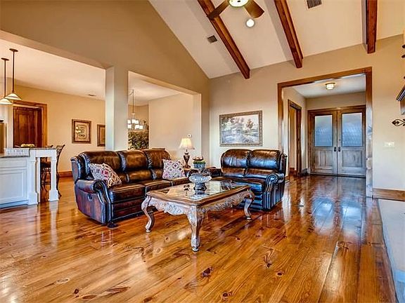 Cathedral ceiling with wood beams. 10ft ceilings in other rooms.