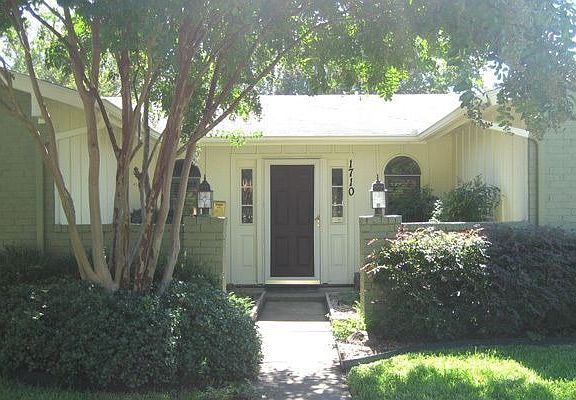 Mature landscaping at front entry