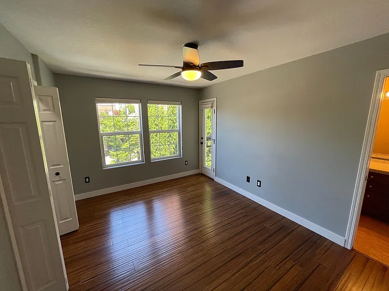 bedroom 1 w/ attached balcony