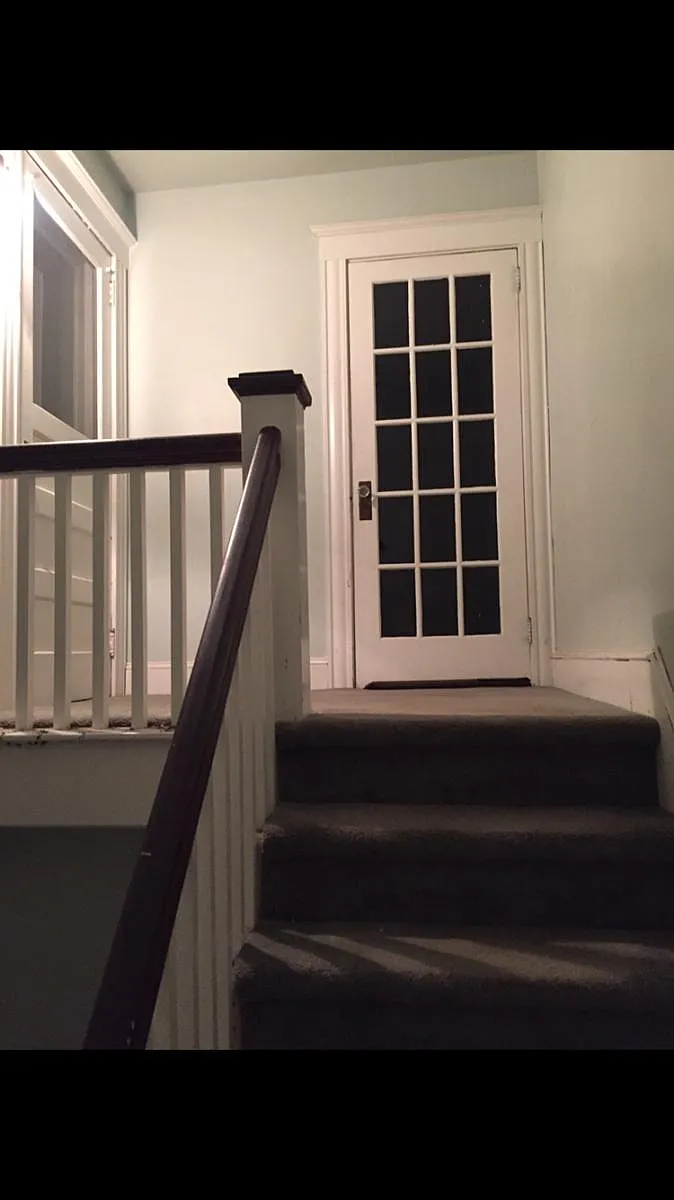 Photo 1 of 15 - Culvert St - Torrington, CT front hall leading to apt and enclosed porch - Culvert St