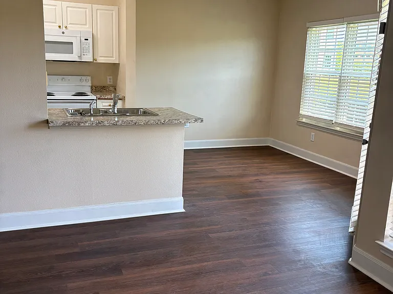 View from living room towards dining area and kitchen.