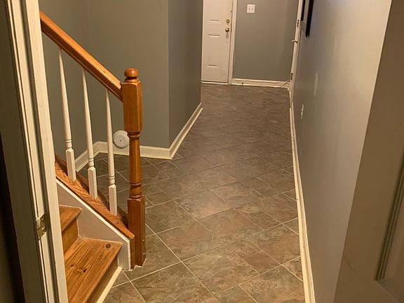 1st floor hallway from back room to front door and garage