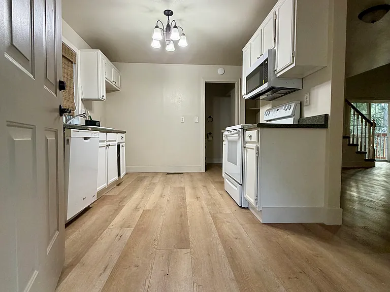 Kitchen from front door and living area to the right