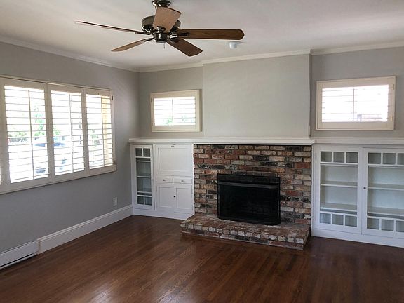 Living Room with fireplace (not functional for burning - candles only) and built in cabinetry