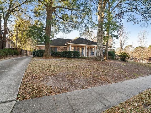 Front of house, driveway with electric gate