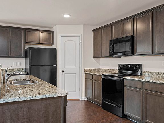 The kitchen comes with a full suite of energy-efficient appliances