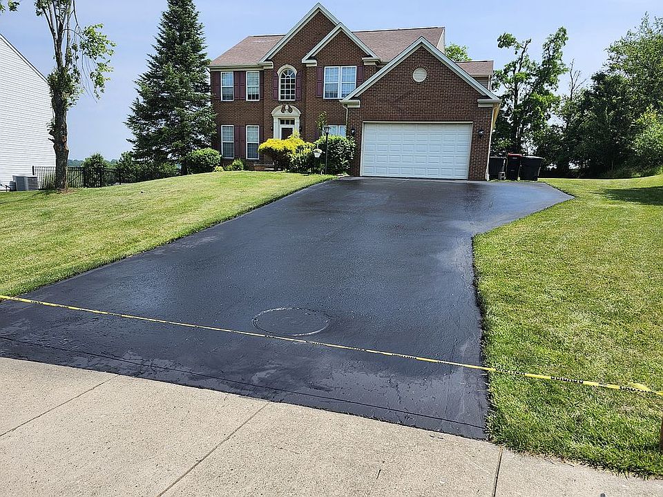 Front with wide driveway