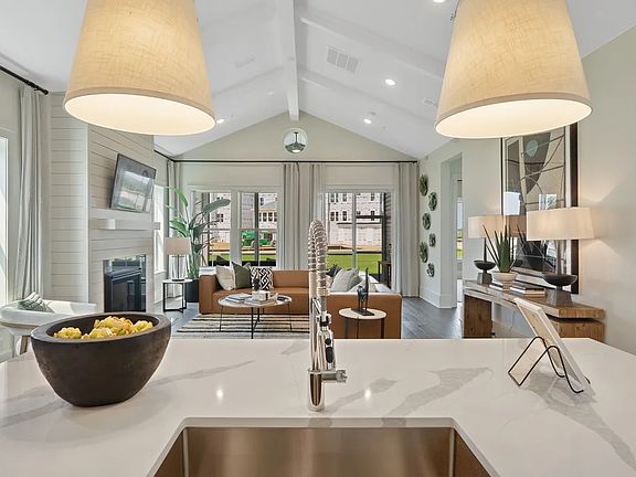 Kitchen with vaulted ceiling and painted ceiling beams