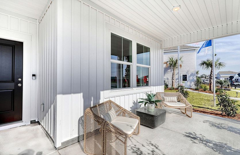 A cozy front porch with space to place outside furniture.