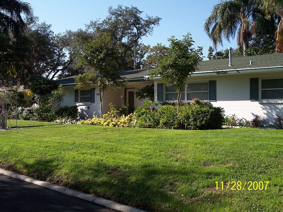 Beautiful, Well-built Home surrounding by Palm and Tababuia Trees