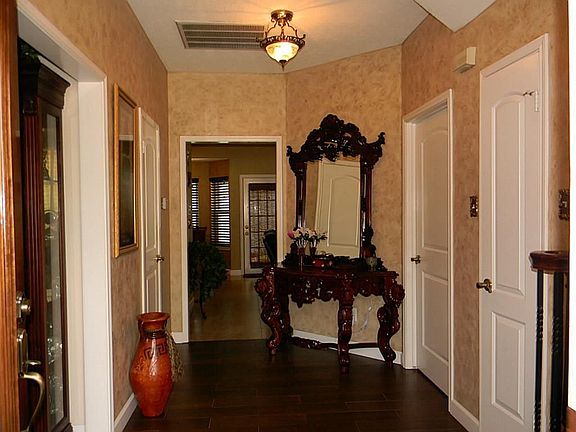 Entry with updated lighting and flooring