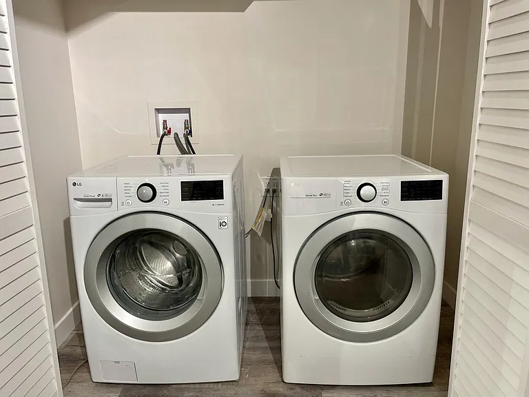 Private full-size washer dryer in basement